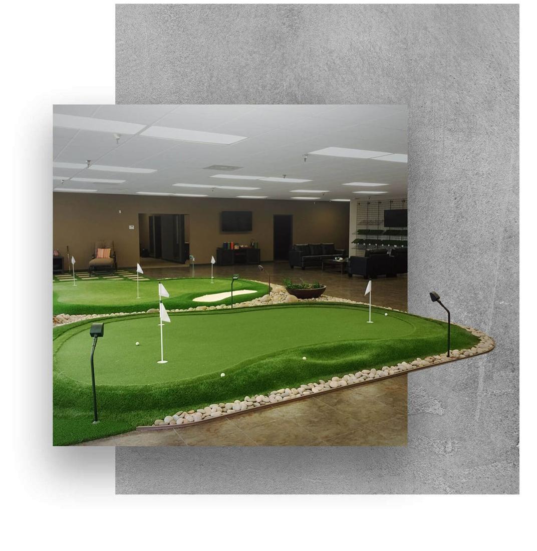 Turf Store Express showroom display with artificial turf and a putting green